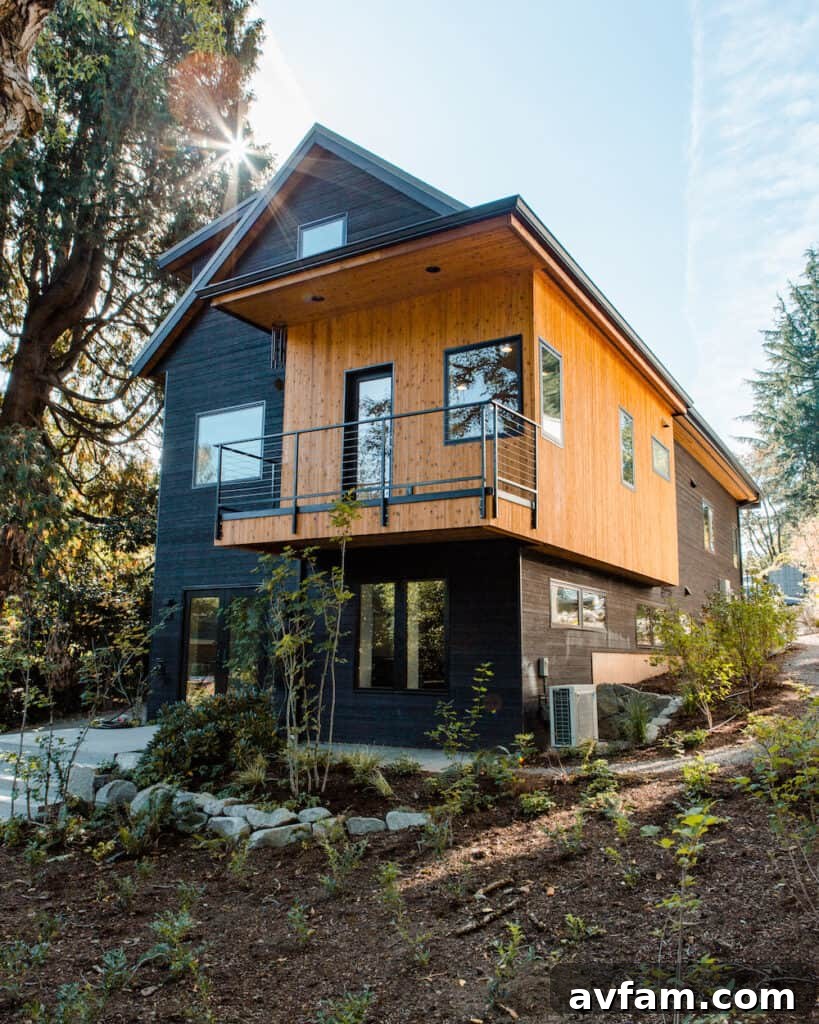 Contemporary residence featuring dark charred wood siding and large windows.