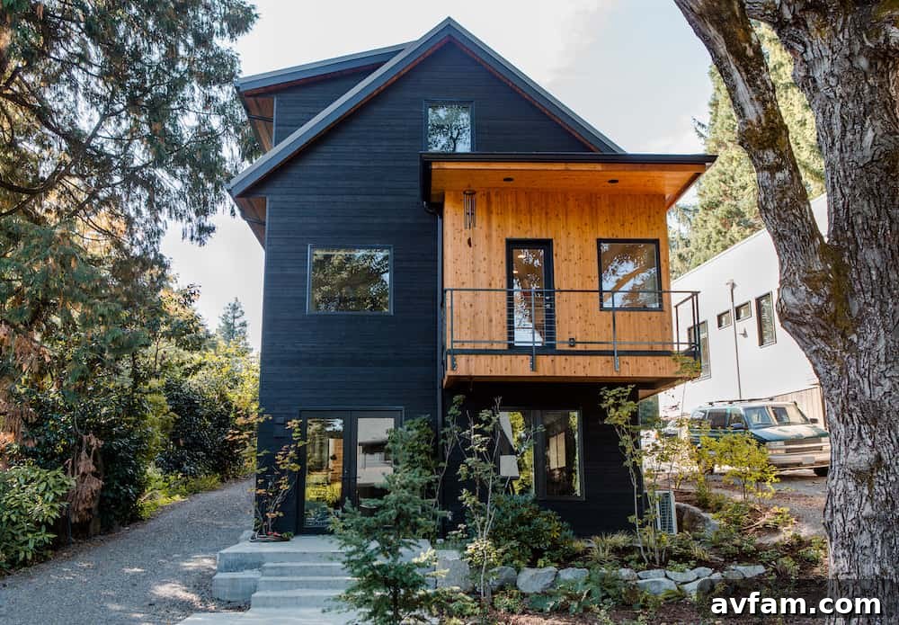 Modern building with a blend of charred wood siding and lighter natural stone.