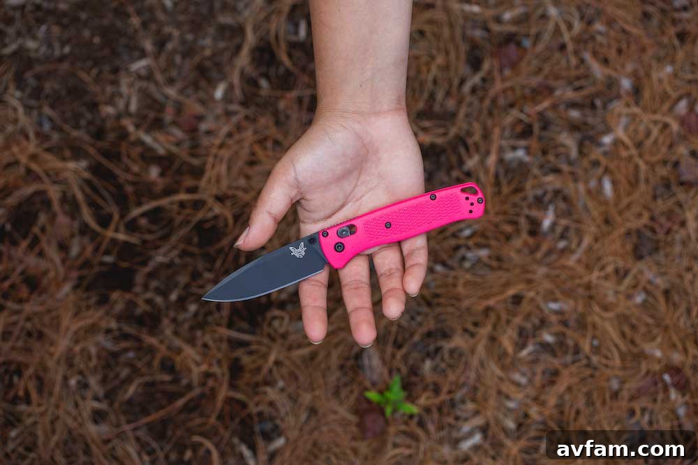 Benchmade Bugout knife with a striking red Grivory handle and dark blade, showcasing vibrant color options