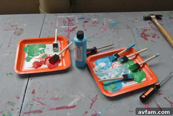 Children engaged in building and painting activities at the Home Depot Kids Workshop during the community event.
