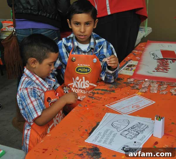 Young participants focused on painting their craft projects at the Home Depot Kids Workshop, fostering creativity and learning.