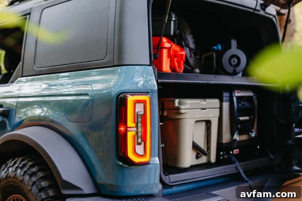 Side view of the Ford Bronco Overland concept showing its rooftop tent and rugged tires.