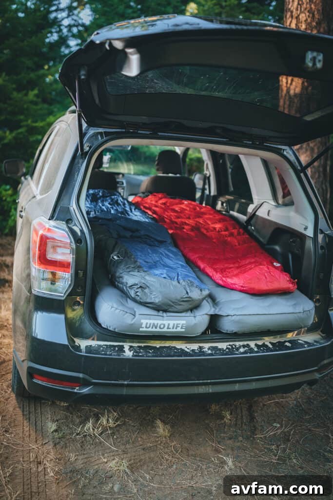 A family enjoying the comfort of the Luno Air Mattress inside their vehicle, highlighting its spaciousness and suitability for car camping