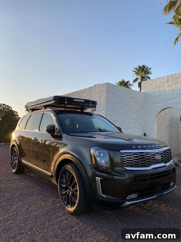 Roofnest Sparrow hard shell rooftop tent viewed from the side, open
