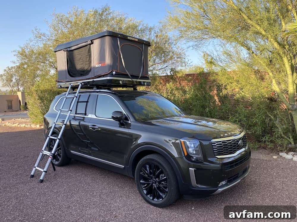Roofnest Sparrow rooftop tent deployed on an SUV from a front angle