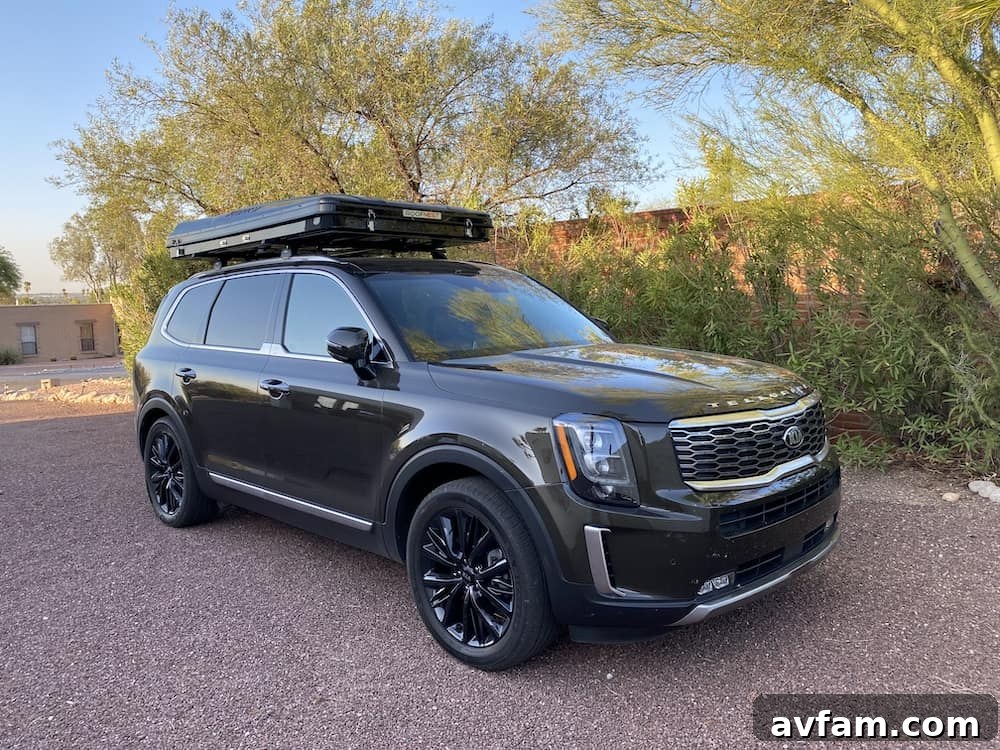 Roofnest Sparrow rooftop tent deployed at a desert camping spot