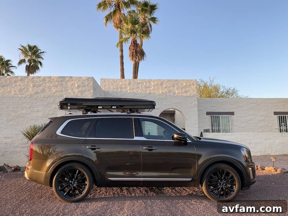 Closed Roofnest Sparrow rooftop tent profile on a car