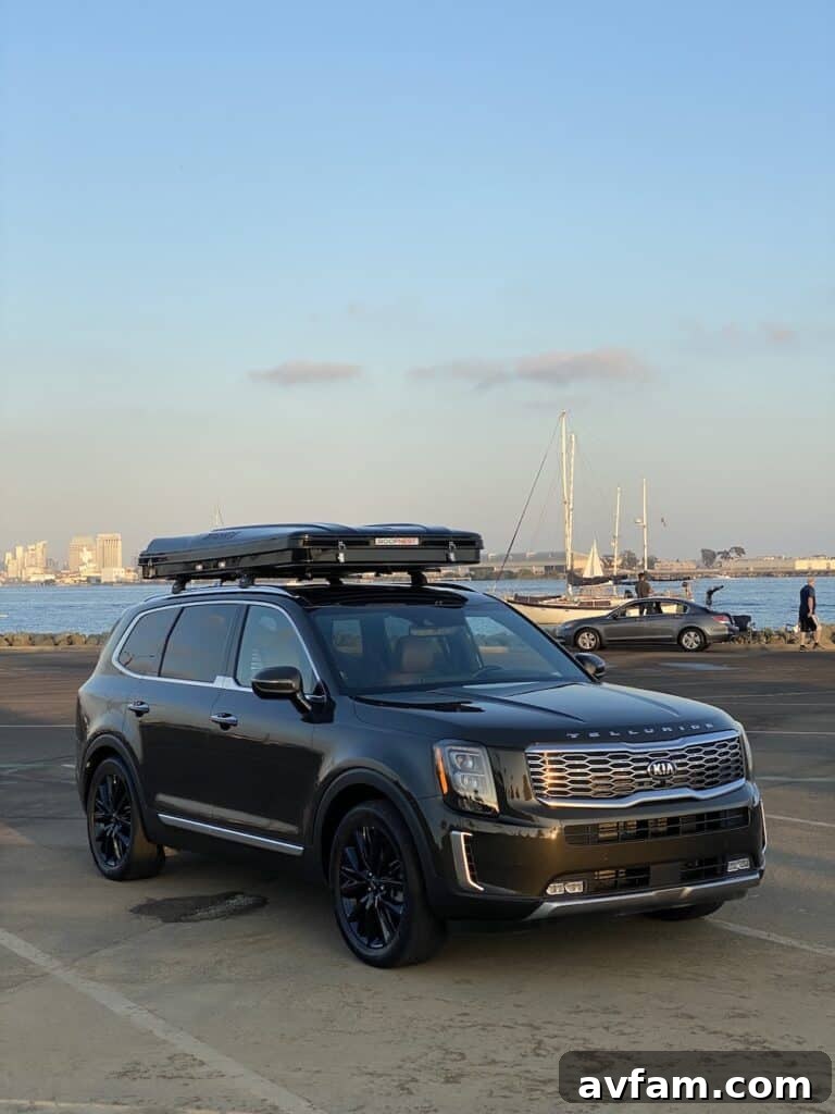 Telescoping ladder leaning against Roofnest Sparrow rooftop tent