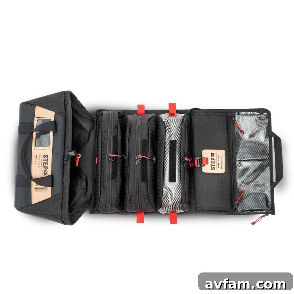 An assortment of tools neatly arranged within the Pangolin Tool Roll's different compartments.
