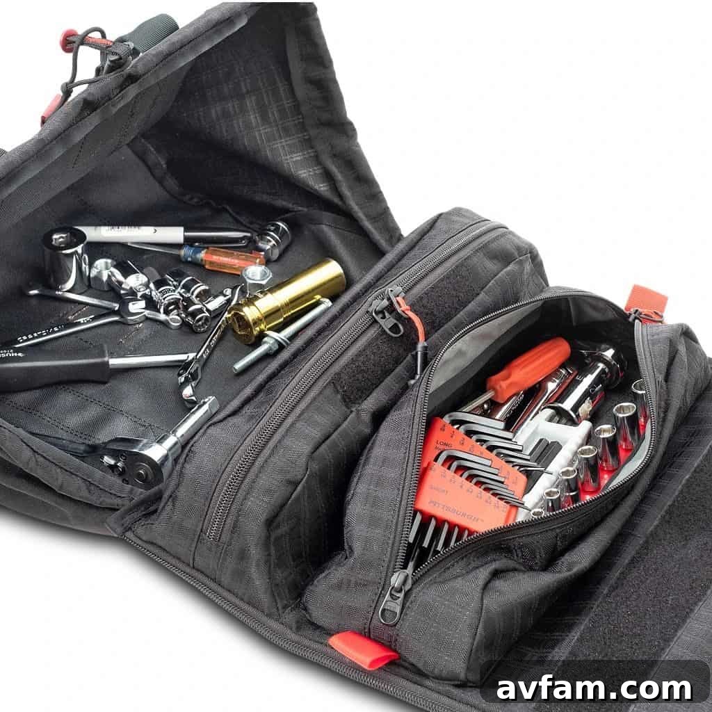 The Pangolin Tool Roll's interior filled with various tools, demonstrating its generous storage capacity.