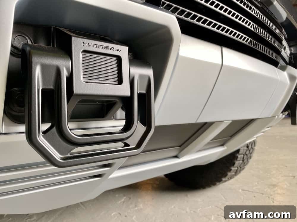 The GMC Hummer EV with its front hood open, revealing its unique styling.