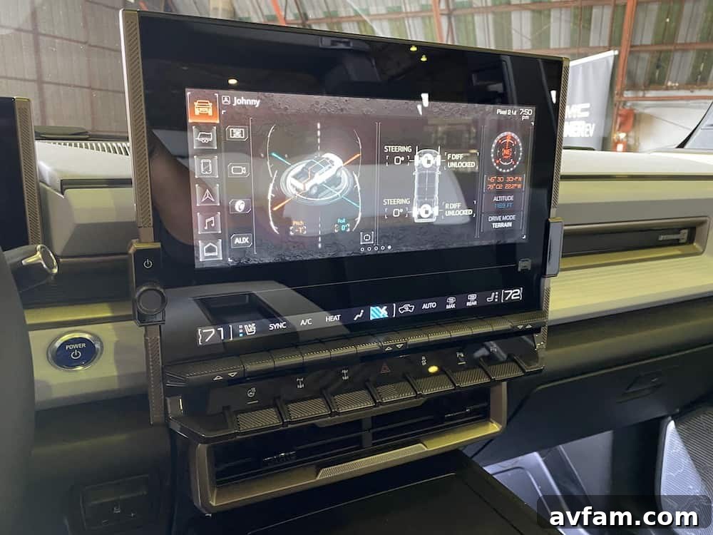 The sophisticated interior of the GMC Hummer EV, featuring a large central display.