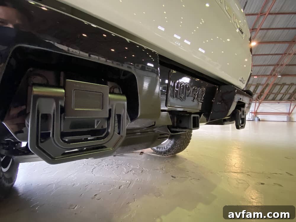 Close-up of the GMC Hummer EV's robust tire and wheel.