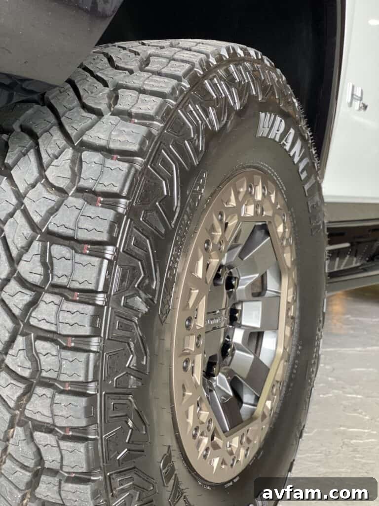 Side profile of the GMC Hummer EV, showcasing its length and presence.