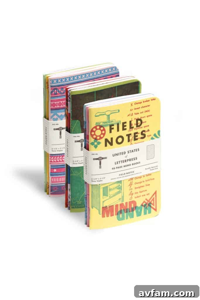 Field Notes Open Book A Field Notes memo book from the United States of Letterpress edition, held open to reveal its pages, emphasizing its functionality and artistic appeal.