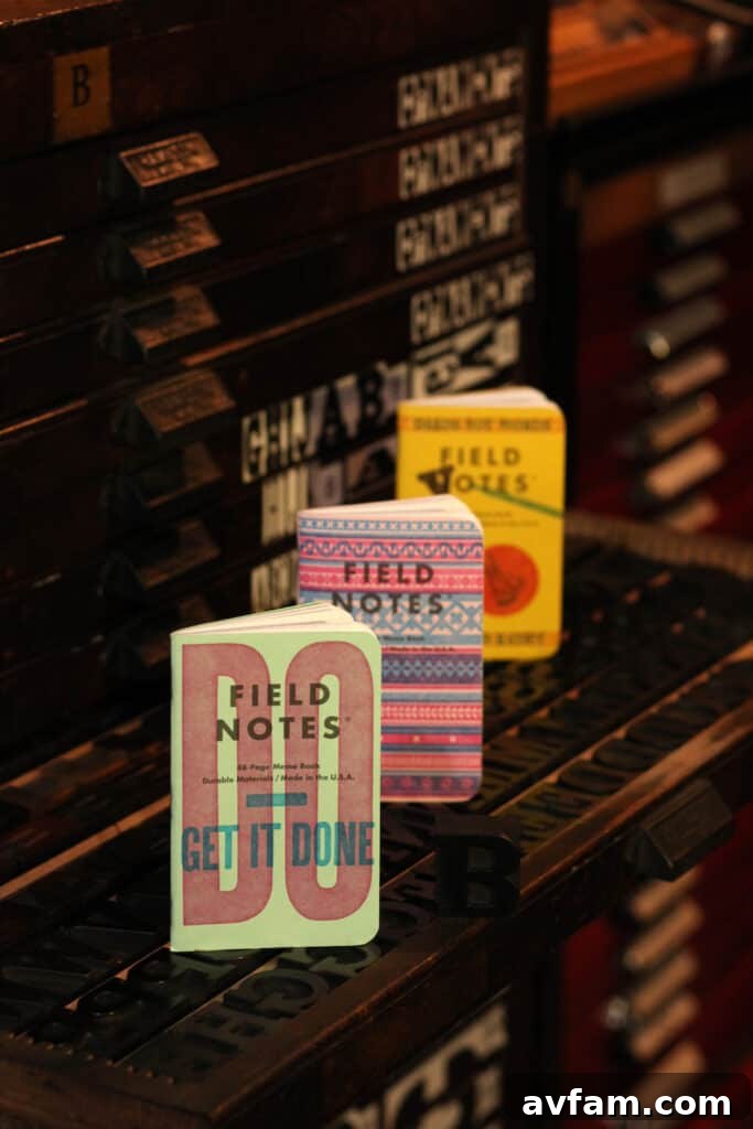 Field Notes Letterpress Interior An open Field Notes memo book from the United States of Letterpress edition, revealing its graph paper interior and unique flysheet with artist information.