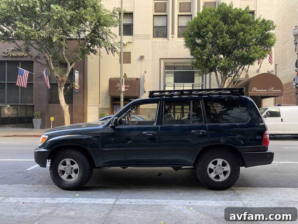 Side view of a 100-series Land Cruiser with a Front Runner Slimline II roof rack