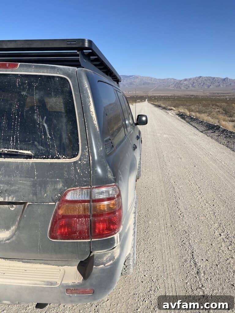 Front Runner Slimline II Roof Rack installed on a 100-series Toyota Land Cruiser, side view