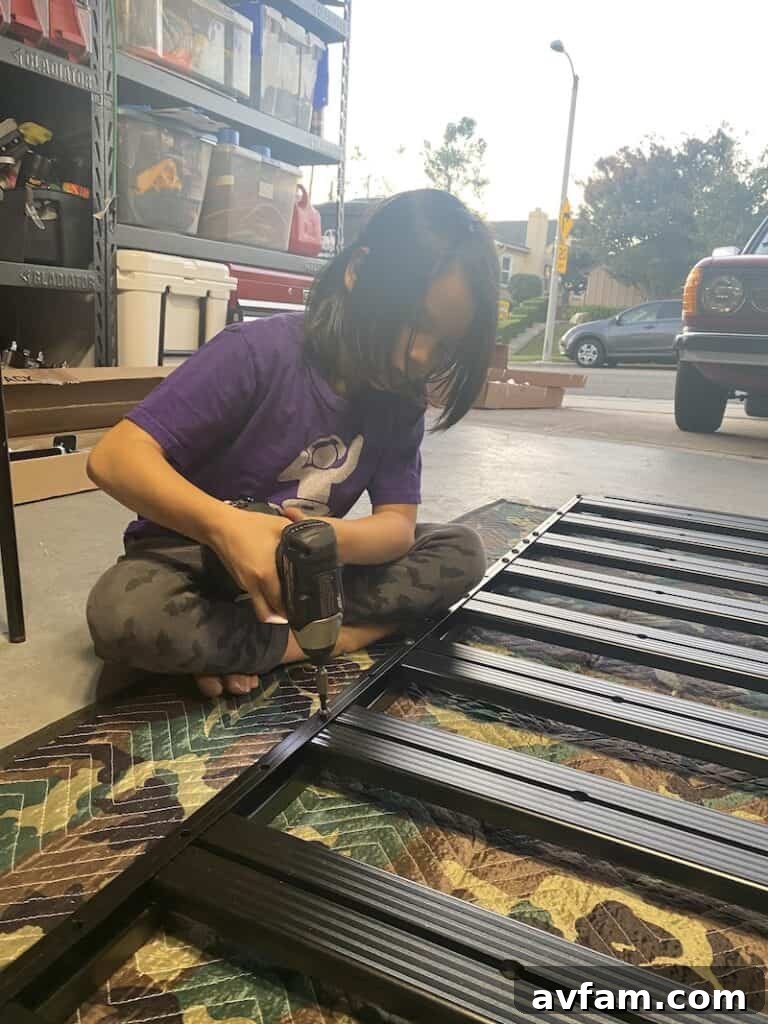 Author's son helping with the initial assembly of the Front Runner Slimline II roof rack