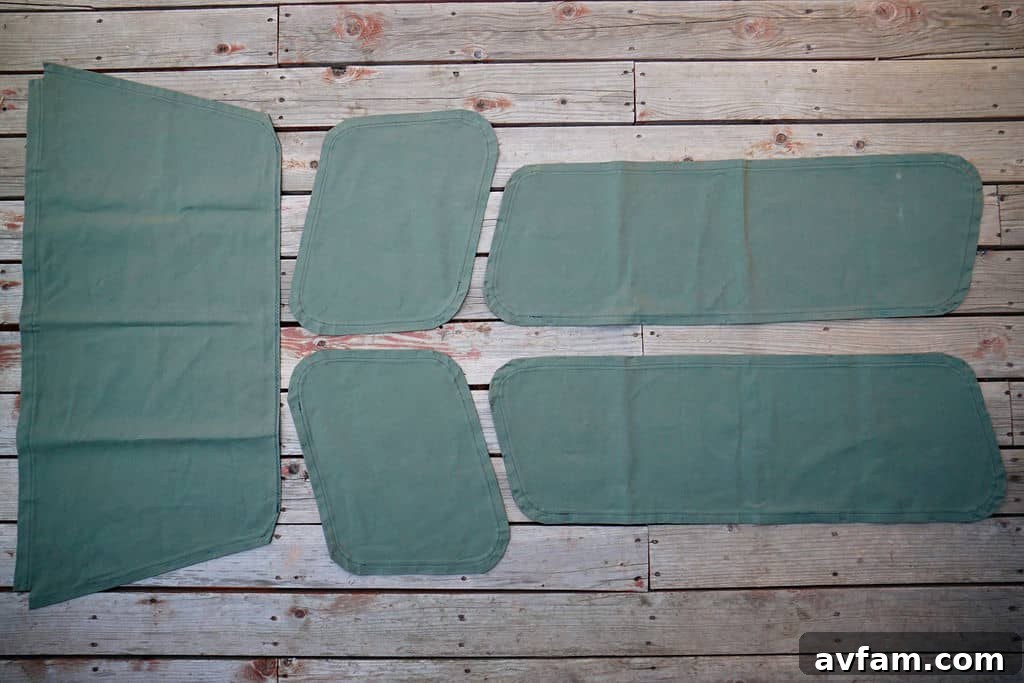Installing snaps onto the finished duck canvas privacy cover.