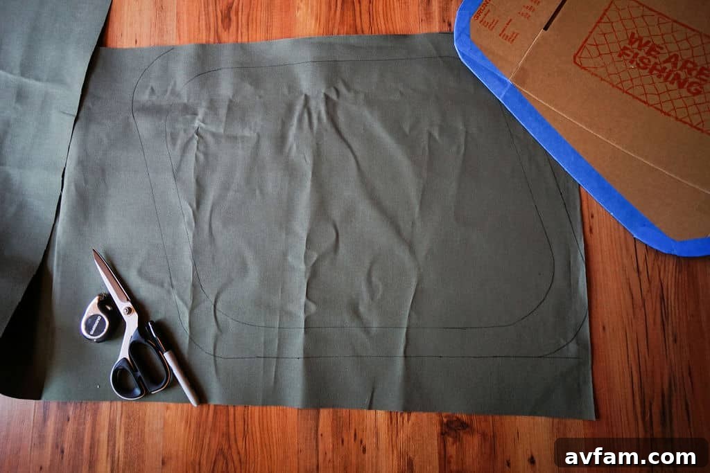 Cutting the traced duck canvas pieces for truck cap window covers.