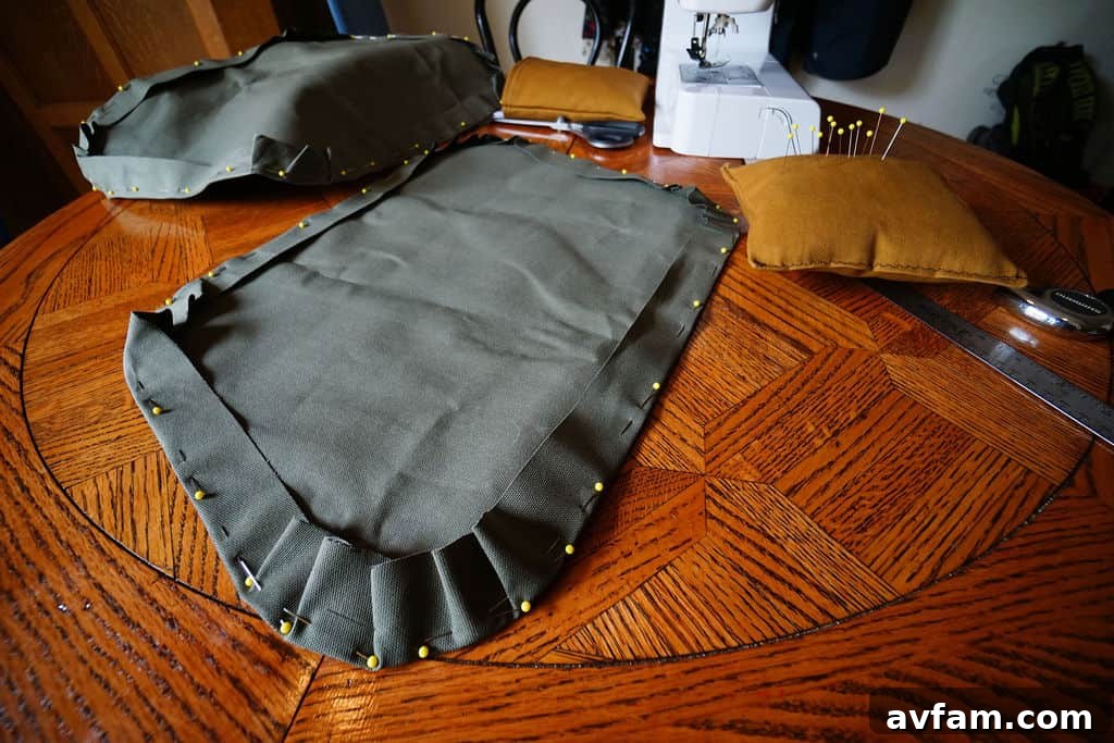 Sewing the hems of the duck canvas privacy covers.