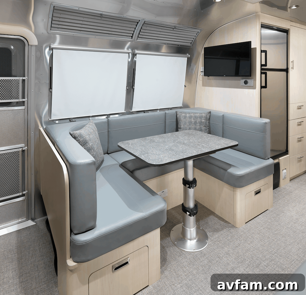 The comfortable office chair in the Airstream Flying Cloud 30FB Office, showing its secure storage and ergonomic design for remote work.