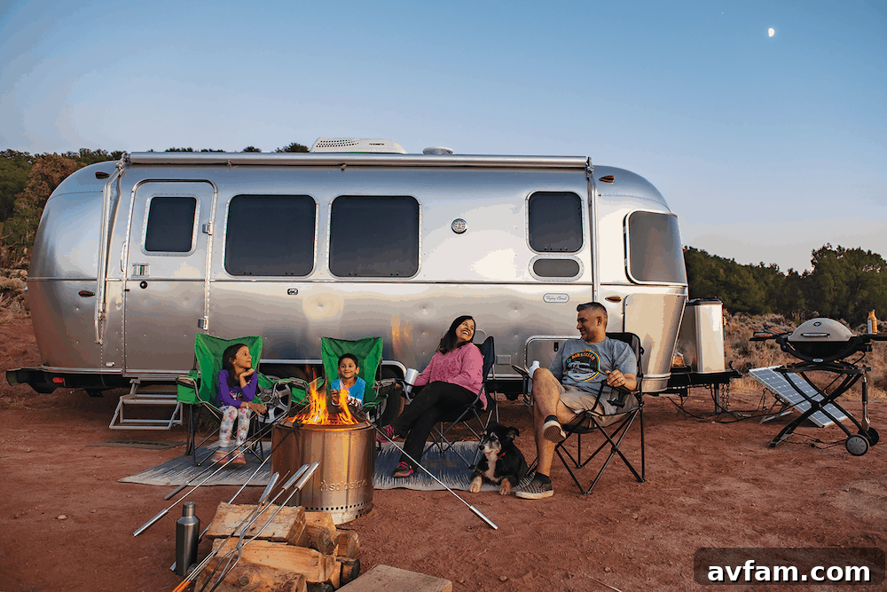 Interior shot of the Airstream Flying Cloud 30FB Office, highlighting the dedicated workspace with a comfortable chair, desk, and ample natural light.