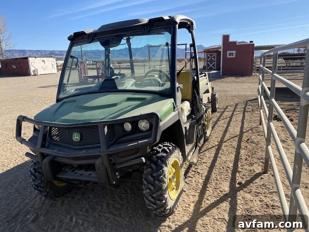 John Deere XUV865M Gator navigating a ranch path