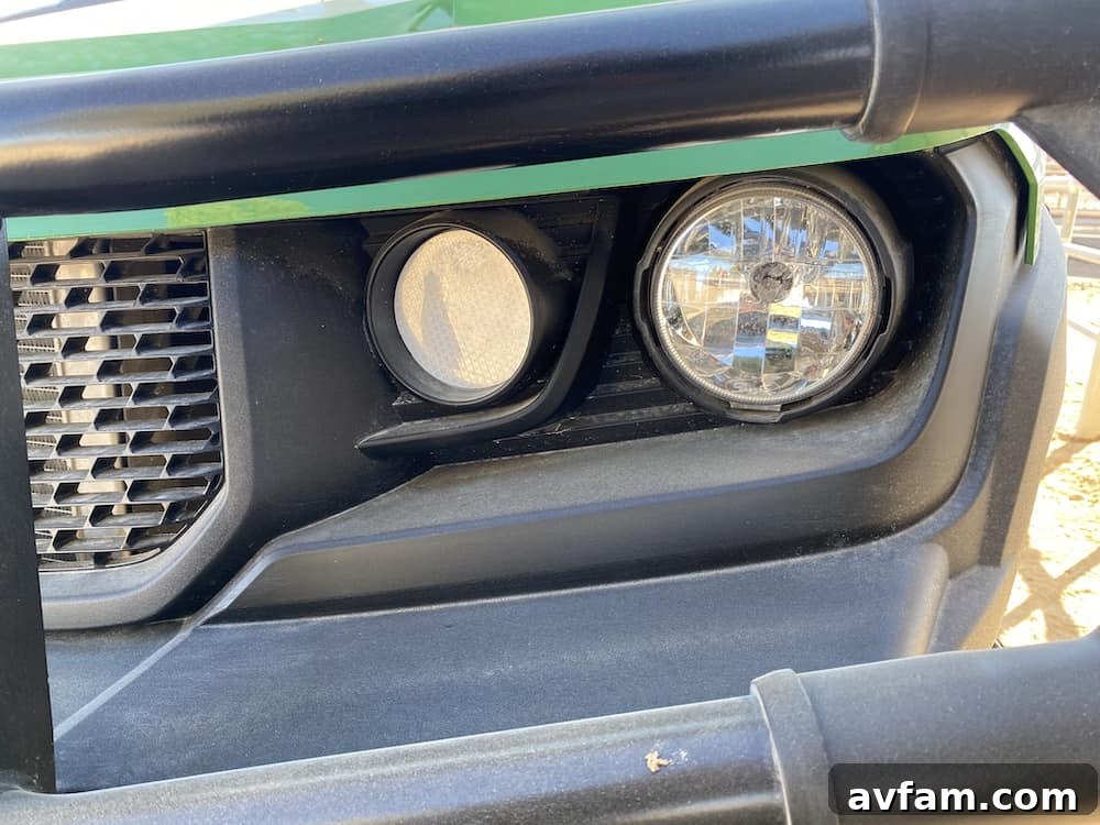 John Deere Gator XUV865M driving across rugged terrain with ease