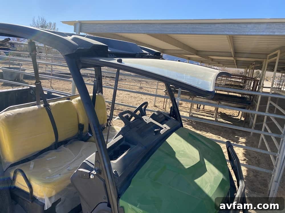 Detail of the flip-up windshield feature on the John Deere Gator XUV865M