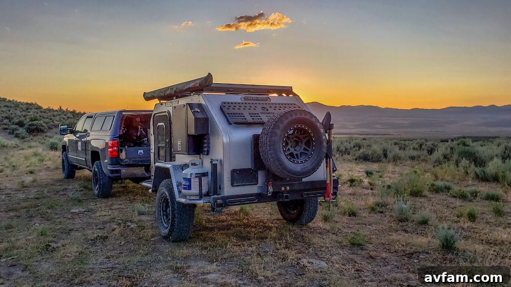 Vorsheer XOC parked by a lake at sunset, illustrating a serene camping scene