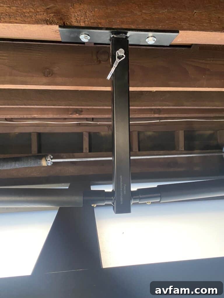 The adjustable height feature of the hanging surfboard rack, showing different possible settings