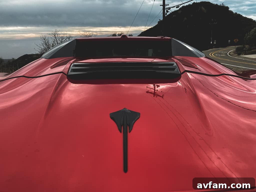 The C8 Convertible making a dynamic turn, showcasing its agile handling and performance.