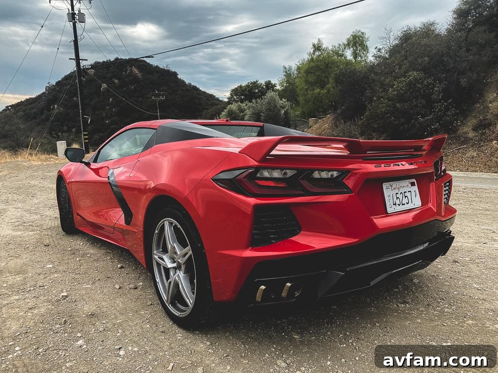 A wide shot of the C8 Convertible driving through a picturesque mountain landscape.