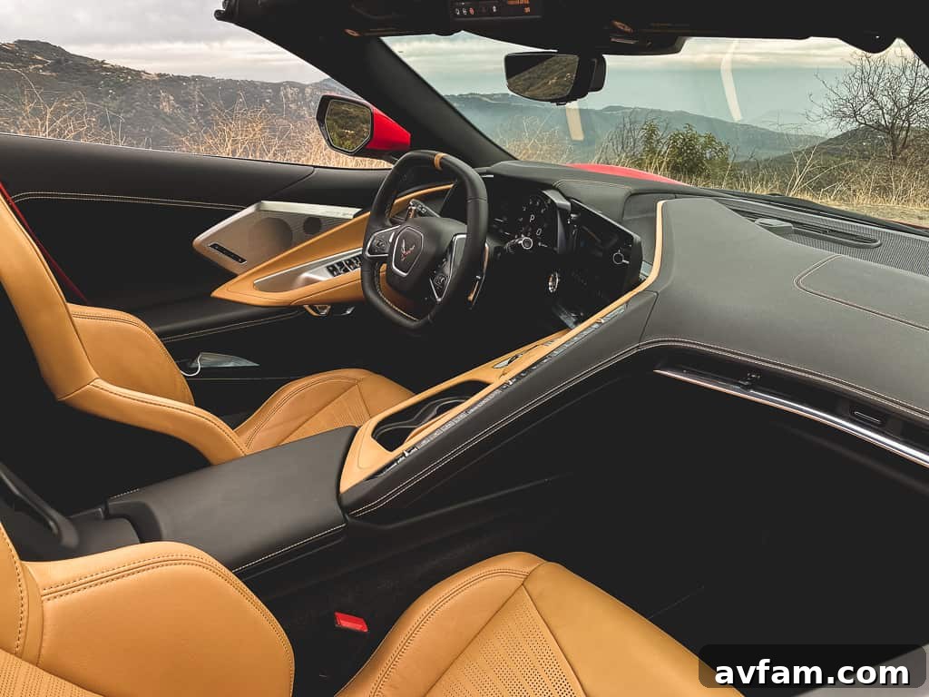The rear-three-quarter view of the red C8 Convertible, highlighting the intricate engine cover and rear vents.