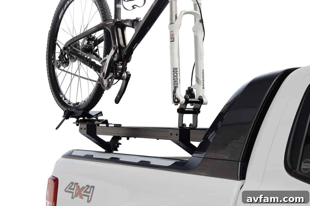 Bike mounted to the side of a Front Runner roof rack, showing good ground clearance