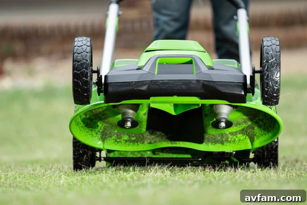 Effortless Greenworks Battery Change A clear demonstration of how easily and quickly a Greenworks 60V battery can be inserted into a tool, emphasizing user-friendly design.