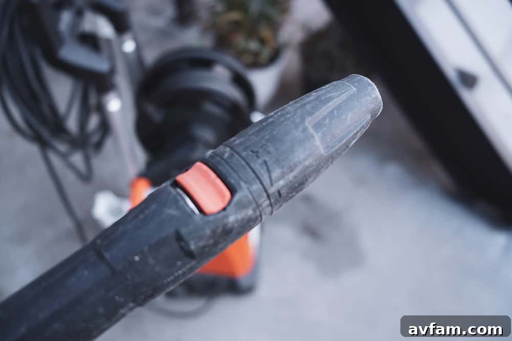 Extended spray lance attachment for reaching high areas with the pressure washer.