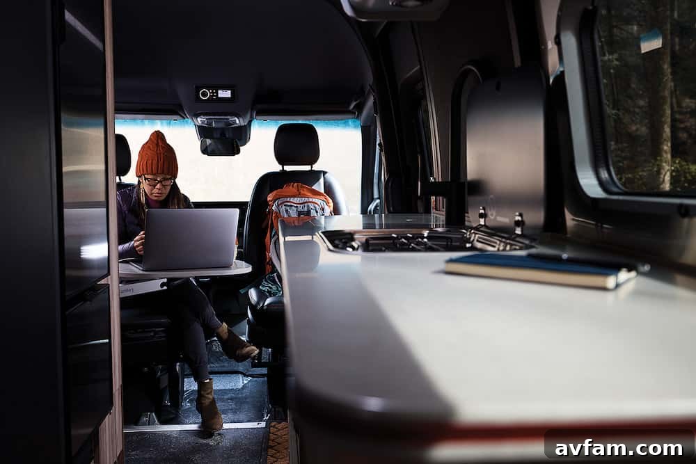 Airstream Interstate 24X interior showing rear seating and table configuration.
