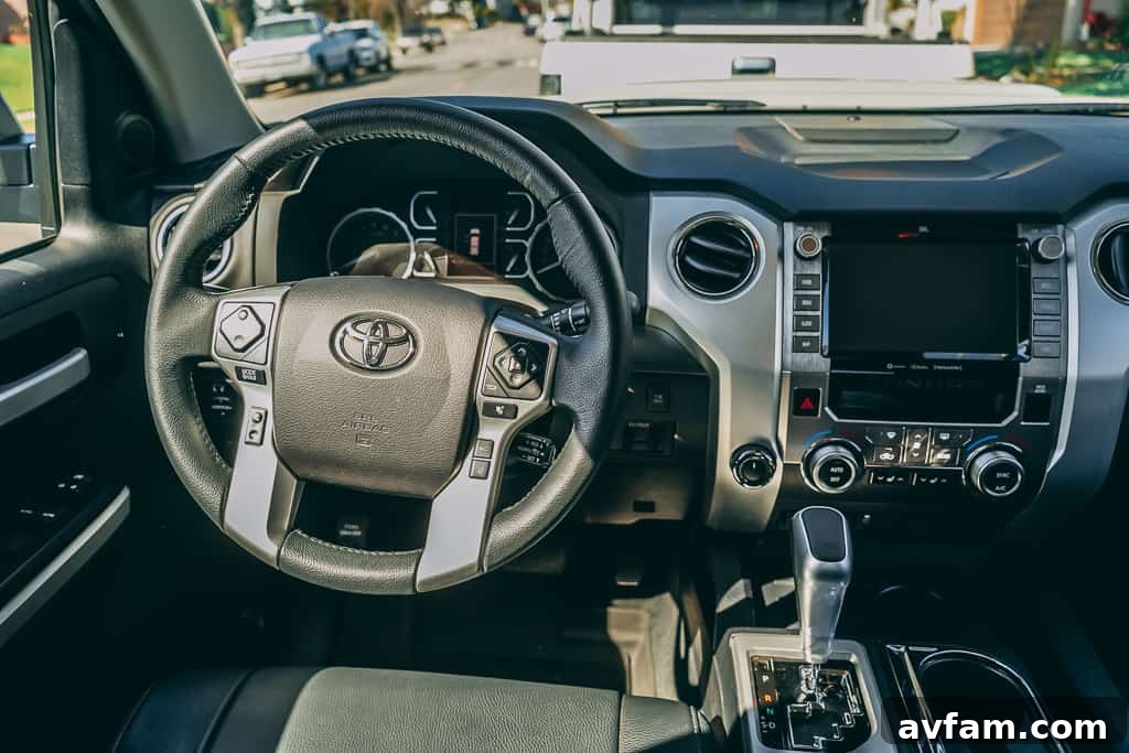 2021 Toyota Tundra TRD Pro driving on a dirt road through a desert landscape