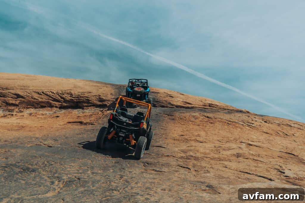 Maverick X3 Climbing in Moab Can-Am Maverick X3 navigating a steep, rocky incline in Moab.
