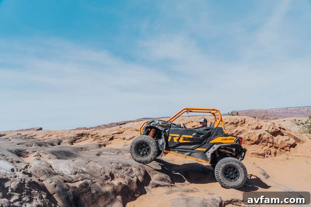 Maverick X3 in Moab Canyon Can-Am Maverick X3 traversing a narrow canyon path.