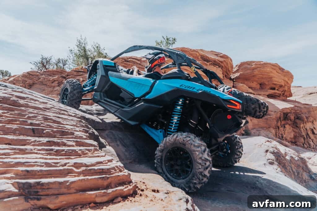 Can-Am Maverick Sport in Moab Can-Am Maverick Sport, stock model, on a scenic Moab trail with red rocks.