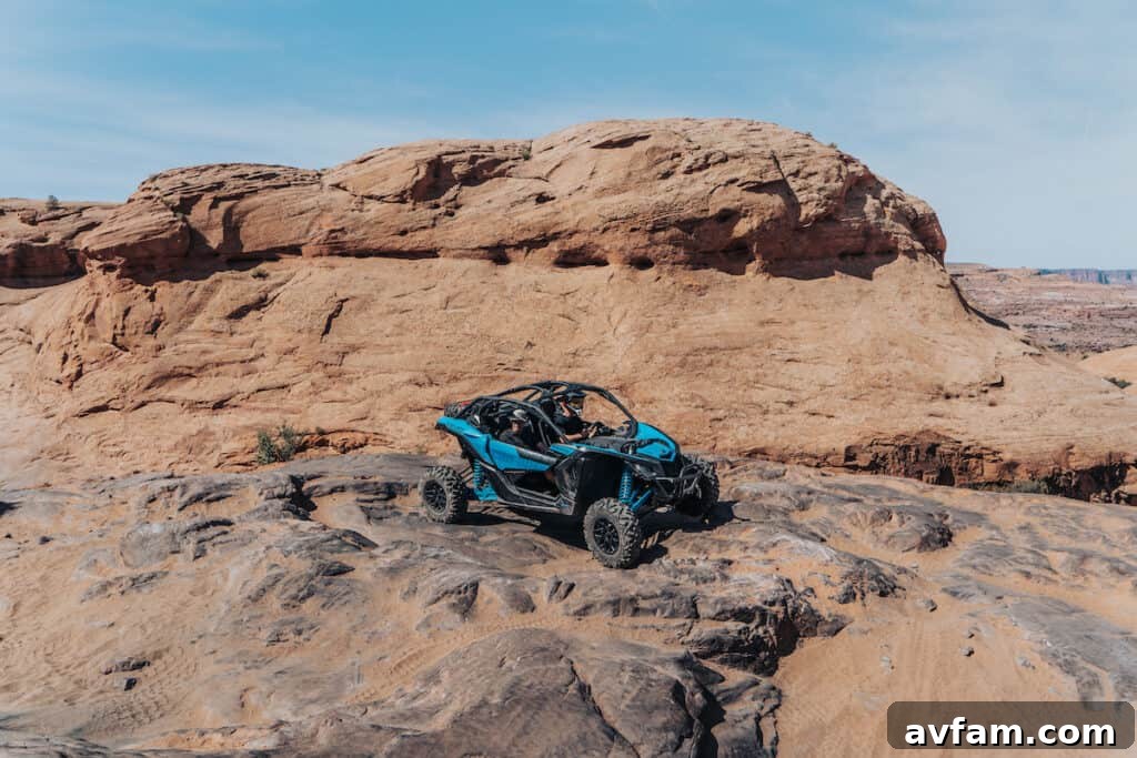 Can-Am Convoy on Rocky Trail View of multiple Can-Am UTVs ascending a challenging rocky path.