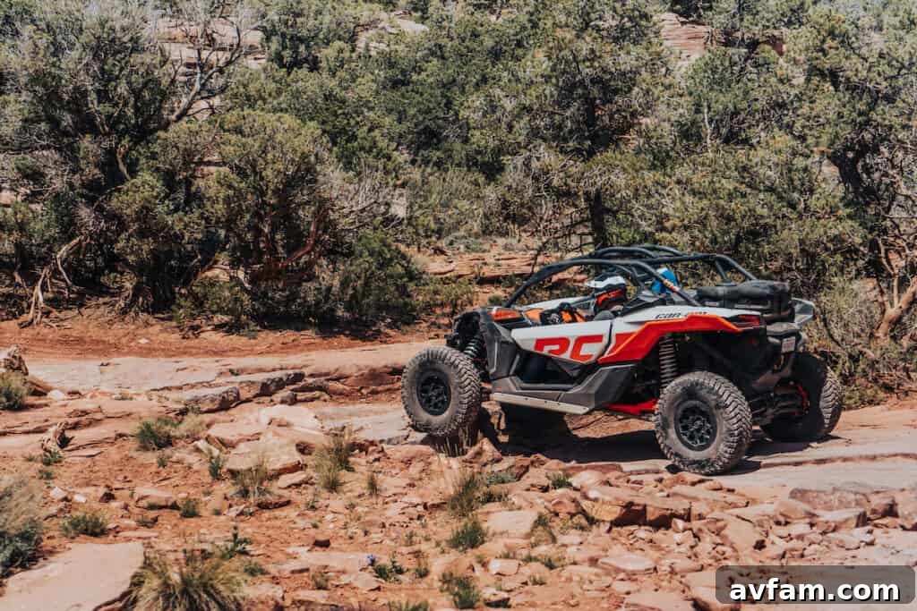 Maverick X3 Rock Crawling Can-Am Maverick X3 navigating a challenging rock section, demonstrating articulation.