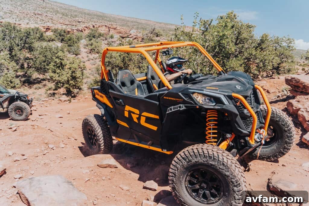 Maverick X3 Scenic View Can-Am Maverick X3 with a scenic Moab backdrop, highlighting the vehicle's rugged design.