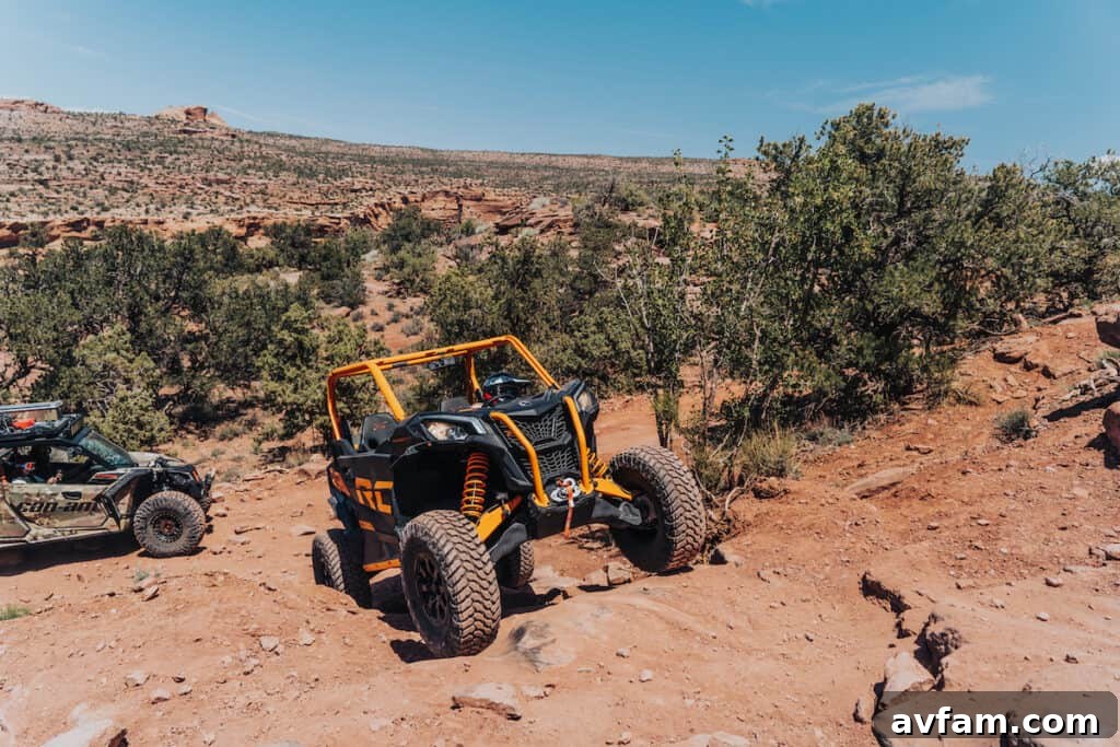 Maverick X3 Tire Tread Can-Am Maverick X3's aggressive stance and tire tread on a dirt road.