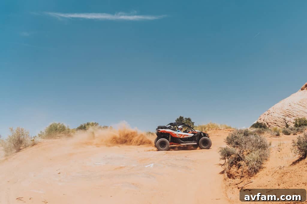 Maverick X3 Desert Vista Can-Am Maverick X3 perched on a high point, overlooking the expansive Moab desert.