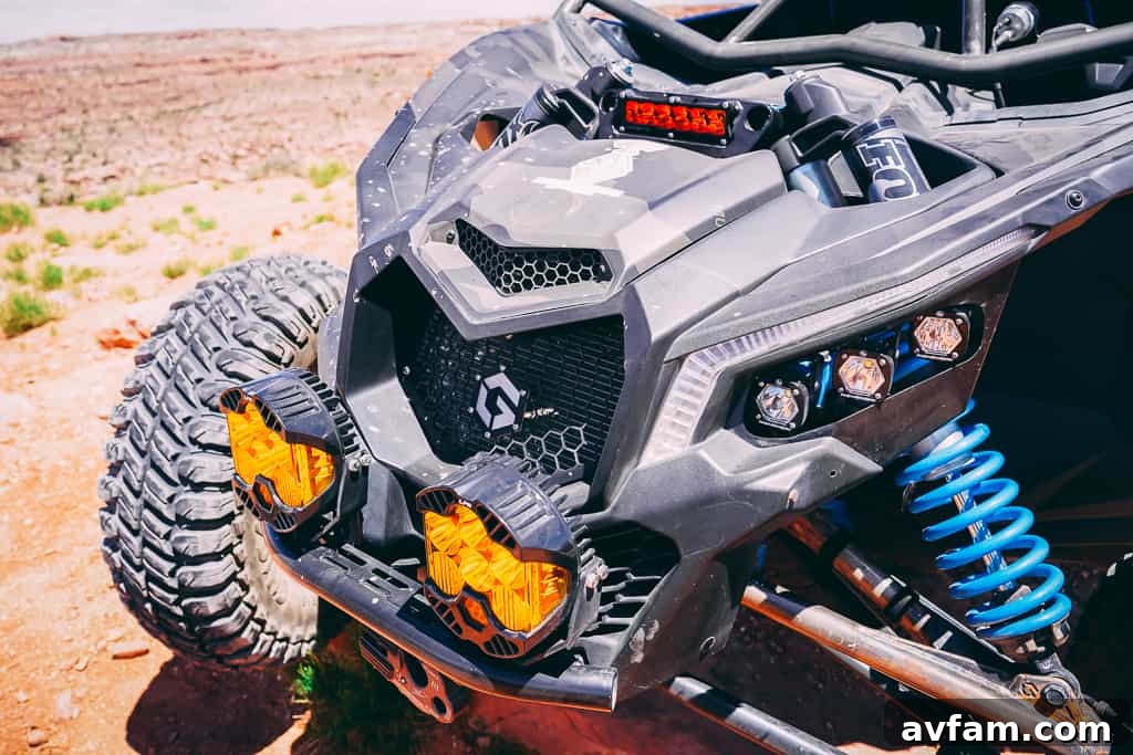 Maverick X3 Kicking Up Dust Can-Am Maverick X3 driving through a dusty trail, highlighting its off-road performance.